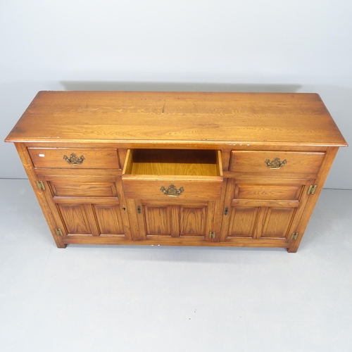 2519 - A reproduction oak sideboard by Bevan Funnell, with three frieze drawers, cupboards under and maker'... 