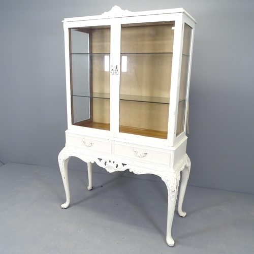 2520 - A continental style display cabinet with two glazed doors above two frieze drawers, two adjustable s... 