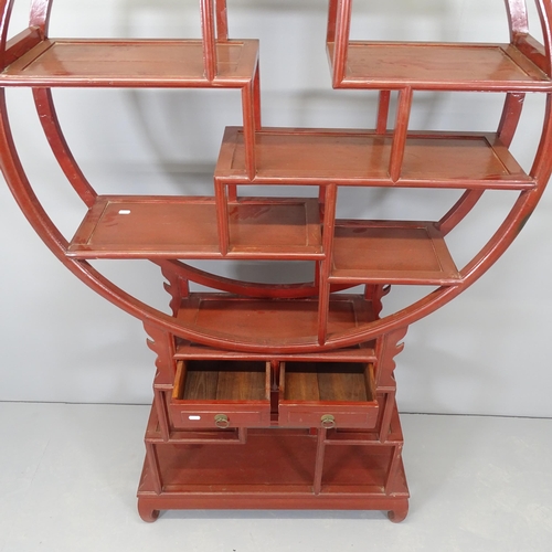 2523 - A Chinese red-lacquered hardwood display unit. 106x184x26cm