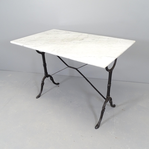 2528 - A marble top garden table on cast iron base. 100x72x61cm.