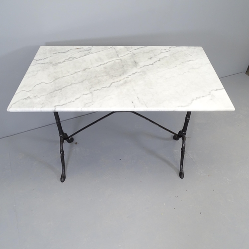 2528 - A marble top garden table on cast iron base. 100x72x61cm.