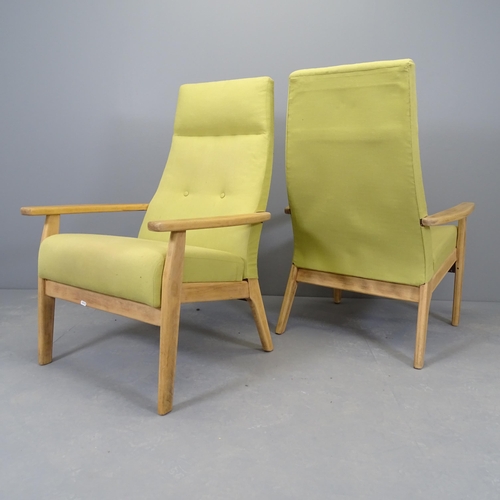 2538 - A pair of mid-century teak and upholstered lounge chairs, in the Danish manner.