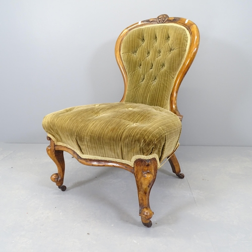 2543 - A Victorian walnut and upholstered nursing chair.