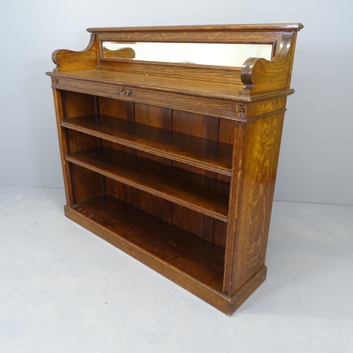 2545 - A Victorian oak open bookcase, with raised mirrored back and two adjustable shelves. 122x107x32cm.