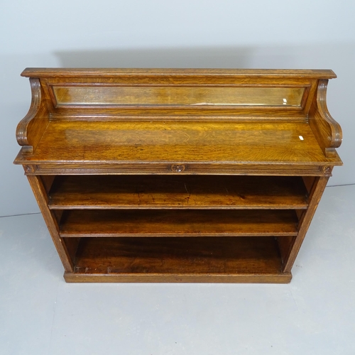 2545 - A Victorian oak open bookcase, with raised mirrored back and two adjustable shelves. 122x107x32cm.