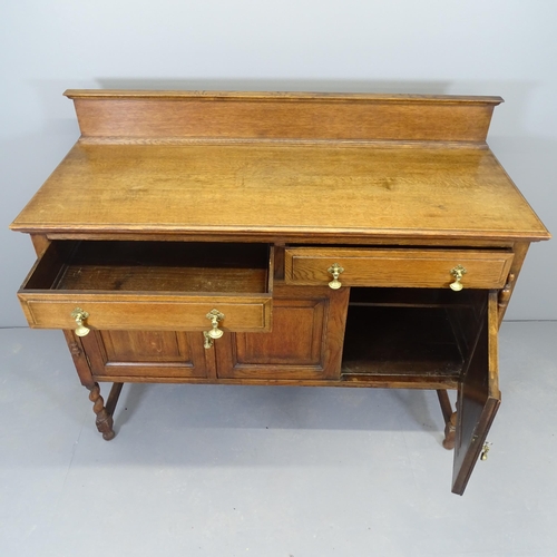 2546 - An early 20th century oak sideboard, with raised back, two frieze drawers and cupboards under. 138x1... 