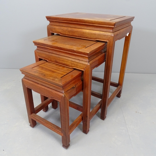 2547 - A nest of three Chinese hardwood occasional tables. 41x36x31cm.