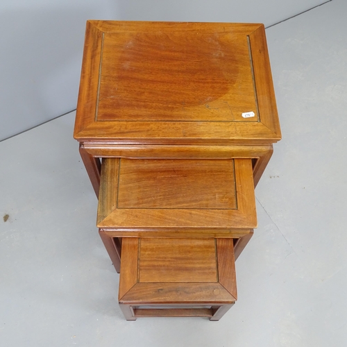 2547 - A nest of three Chinese hardwood occasional tables. 41x36x31cm.