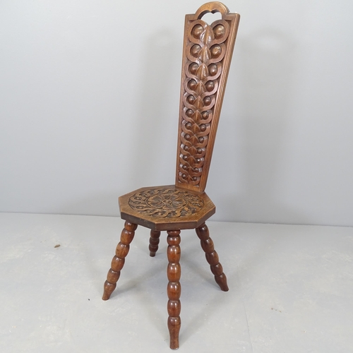 2548 - A carved oak spinning stool, on bobbin turned legs.