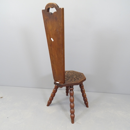 2548 - A carved oak spinning stool, on bobbin turned legs.