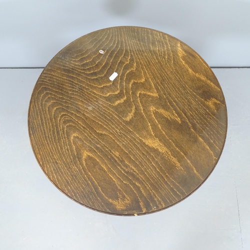 2549 - A French elm circular topped occasional table, raised on turned column with platform base. 50x56cm.