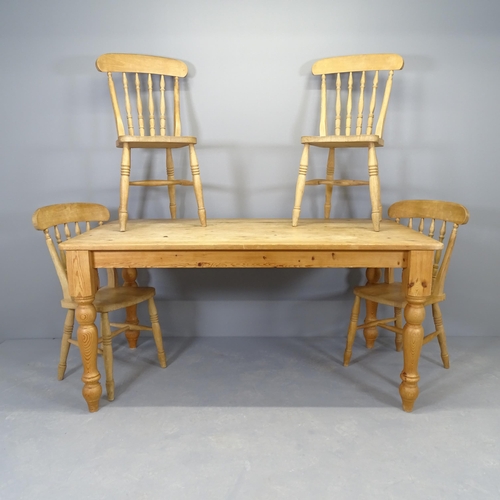 2551 - A modern pine scrub top dining table raised on turned legs, 159x77x85cm, and four matching chairs.