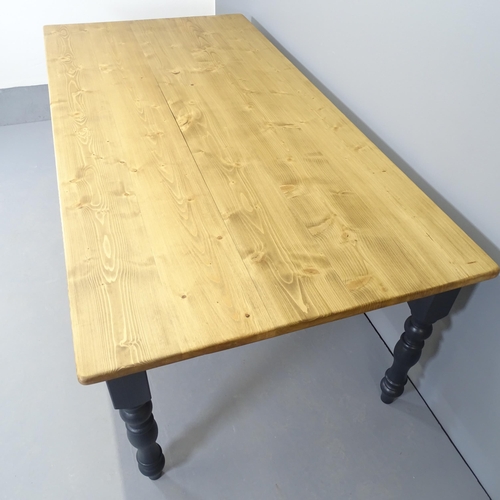 2553 - A modern painted pine dining table, with turned legs. 210x77x105cm