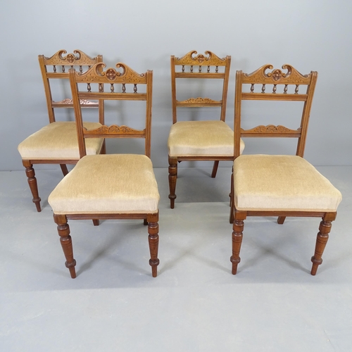 2554 - A set of four late Victorian walnut and upholstered dining chairs.