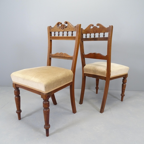 2554 - A set of four late Victorian walnut and upholstered dining chairs.