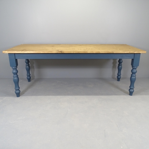 2556 - A modern painted pine dining table, on turned legs. 210x77x84cm.