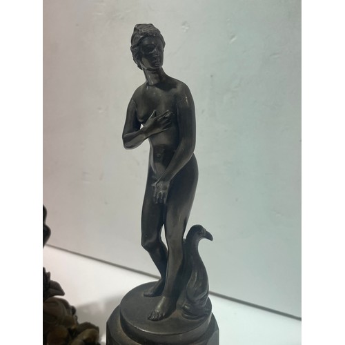 88 - A small Classical bronze nude on white metal plinth, and another reproduction bronze figure