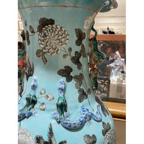 21 - 2 large blue glazed Chinese vases with applied dragon and lion decoration, height 47cm, A/F
