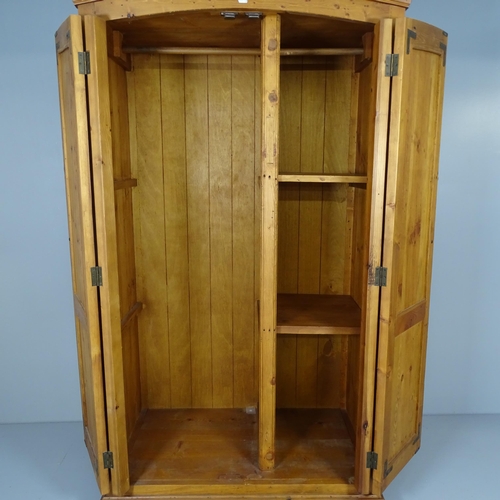 2564 - A modern pine two door dome-top wardrobe. 108x191x61cm