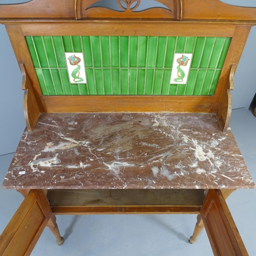 2563 - A Victorian mahogany marble-topped wash stand, with raised tiled back, cupboards under, raised on tu... 