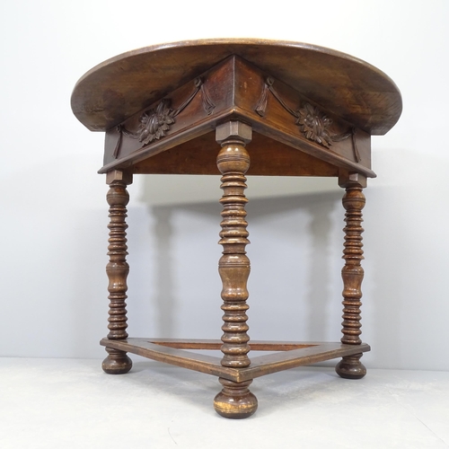 2571 - An early 20th century mahogany demi-lune console table, with applied carved swag decoration and rais... 