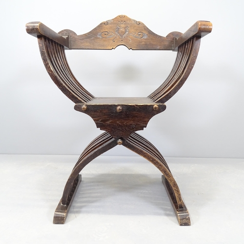 2574 - An antique mahogany Savonarola chair.