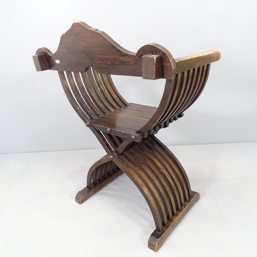 2574 - An antique mahogany Savonarola chair.