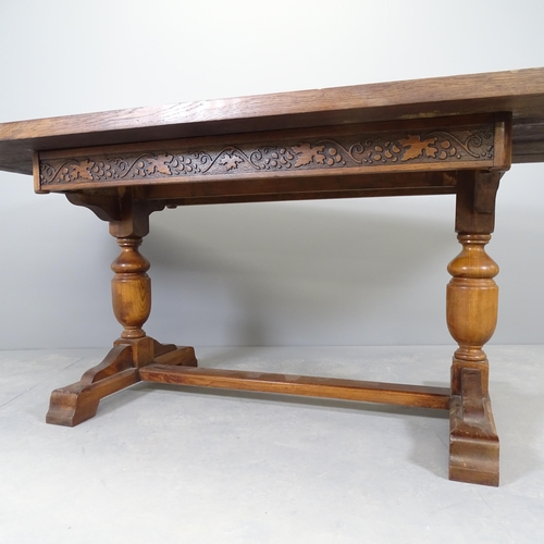 2580 - An antique oak refectory dining table, raised on baluster turned legs with H-shaped stretcher. 183x7... 