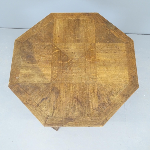 2591 - A French oak octagonal topped occasional table, on spiral-turned elm column. 62x68cm