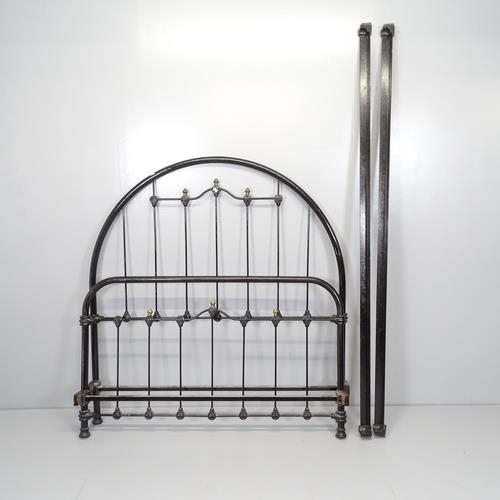 2598 - A Victorian cast iron 4' small double bed. With side rails, no slats.