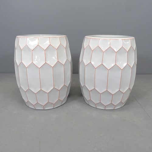 2607 - A pair of modern ceramic garden seats by Fabienne Jouvin, with geometric design and maker's mark. 35... 