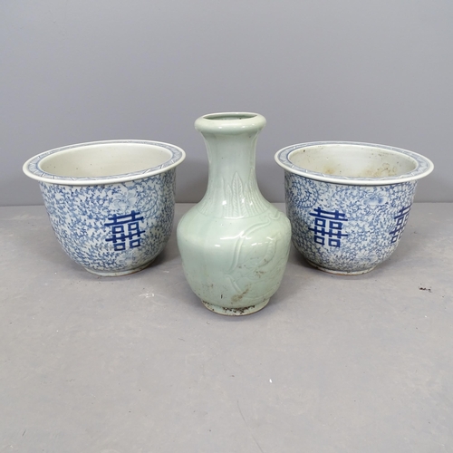 2611 - A pair of modern Chinese blue and white garden pots, 30x23cm, and a green ceramic vase with characte... 