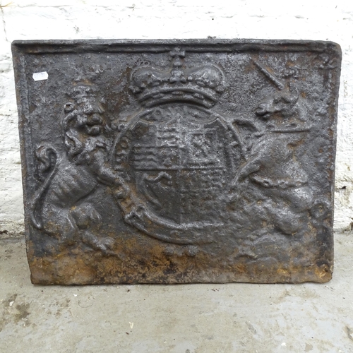 2614 - An antique cast iron fire back. 54x44cm.