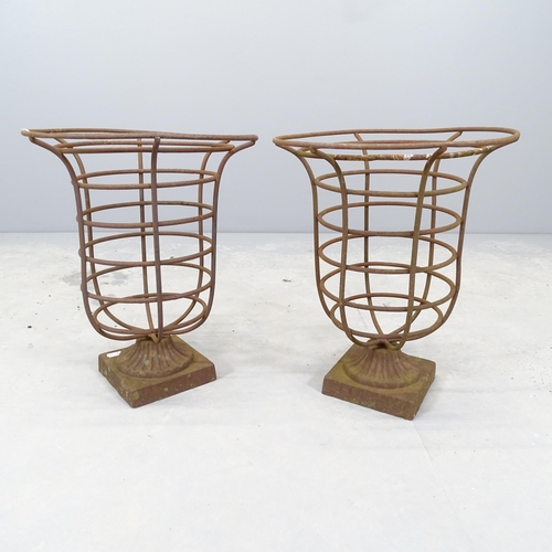 2616 - A pair of wrought iron plant stands. 32x38cm.