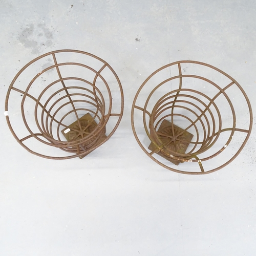 2616 - A pair of wrought iron plant stands. 32x38cm.