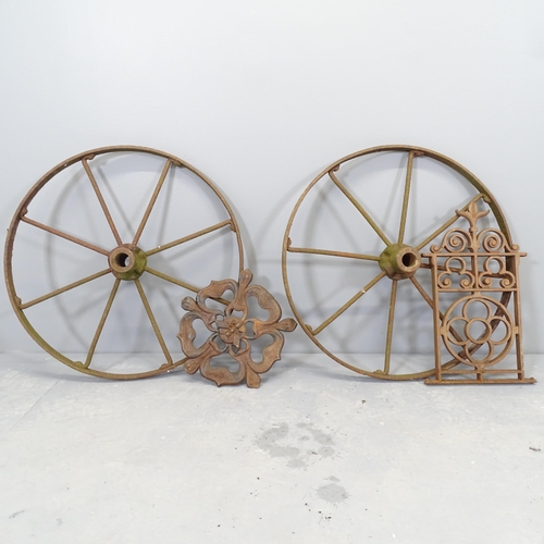 2617 - A pair of vintage cart wheels, Diameter 60cm, and two iron wall plaques (4).