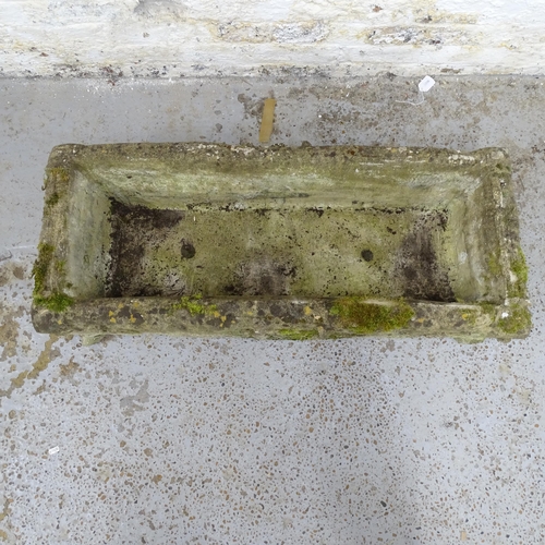 2629 - A weathered concrete rectangular garden trough. 104x27x43cm