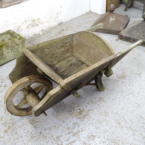 2631 - A vintage pine wheel barrow. 135x57x64cm.