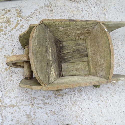 2631 - A vintage pine wheel barrow. 135x57x64cm.