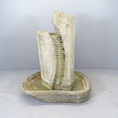 2633 - A resin stone-effect garden water fountain. 100x125x70cm.