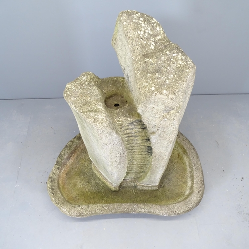 2633 - A resin stone-effect garden water fountain. 100x125x70cm.