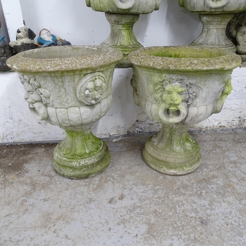 2635 - A pair of two-section weathered concrete garden planters with lion mask decoration. 55x66cm. WITH TH... 