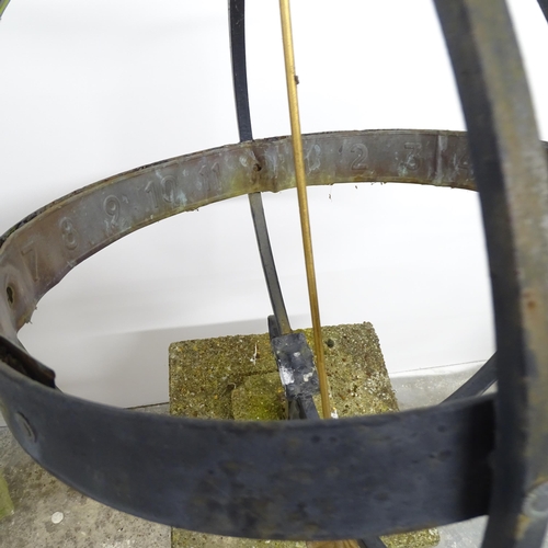 2641 - A wrought iron armillary sphere, mounted on a weathered concrete plinth. 42x130x45cm.