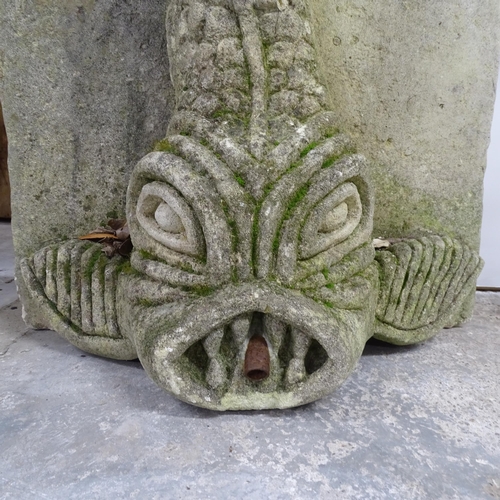 2642 - A weathered carved stone fish water fountain. 60x85x30cm.