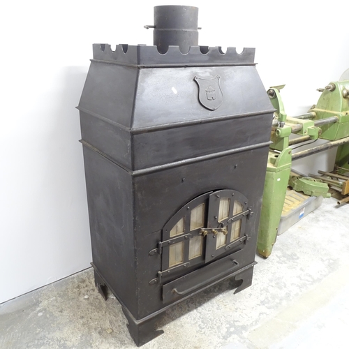 2644 - A cast iron wood burning stove. 78x140x65cm