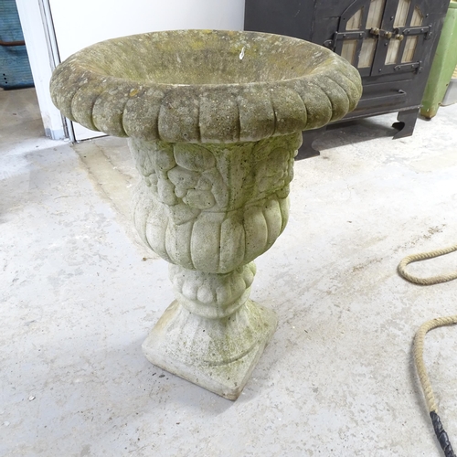 2645 - A weathered concrete garden urn. 50x68cm.