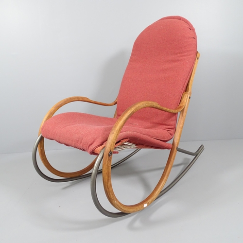 2057 - A mid-century Swiss Nonna rocking chair by Paul Tuttle for Strassle, having a steam bent laminated o... 