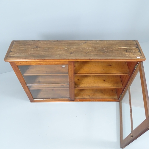 2059 - An antique mahogany bookcase, with two glazed doors and two fixed shelves. 127x84x28cm