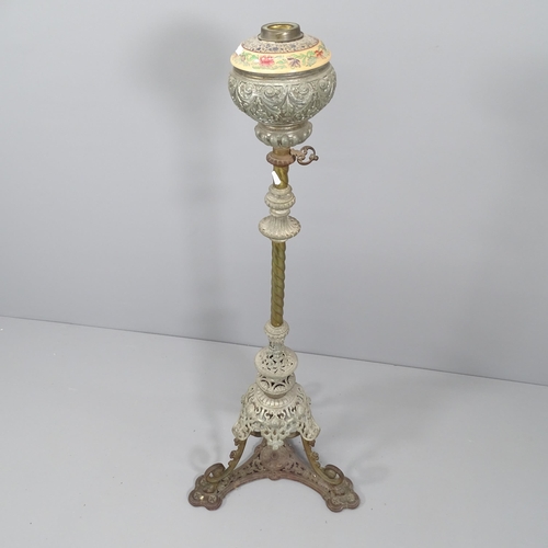 2065 - An antique wrought iron oil lamp stand, lacking burner and shade. Height 122cm.