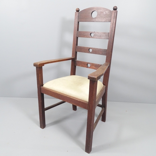 2071 - An Arts & Crafts oak ladder back armchair with heart and circle cut-outs.